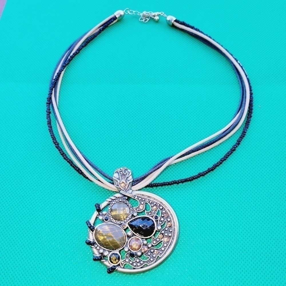Fabulous design corded neckpiece with antique pedant.